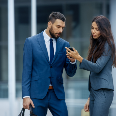 Professional workers looking at phone