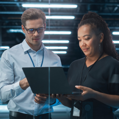 Office workers looking at a laptop