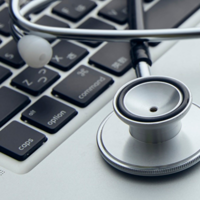 Stethoscope on Mac Book computer