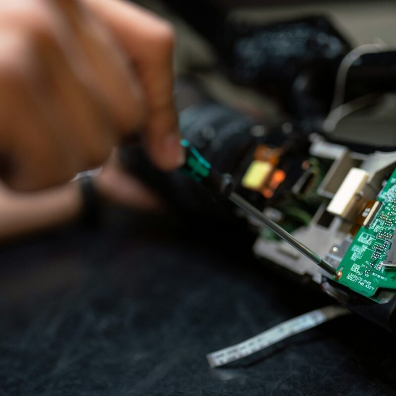 Closeup of repairing a printed circuit board