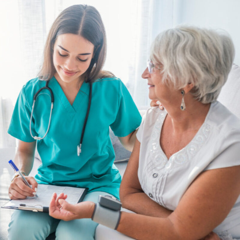 Nurse with elderly patient