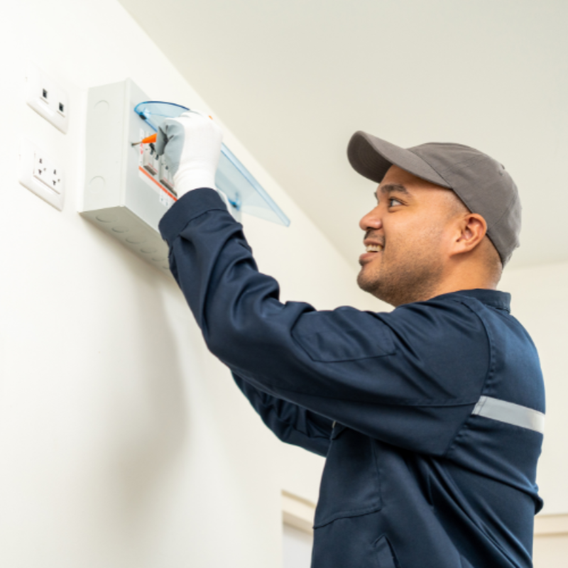 Technician working on wall box