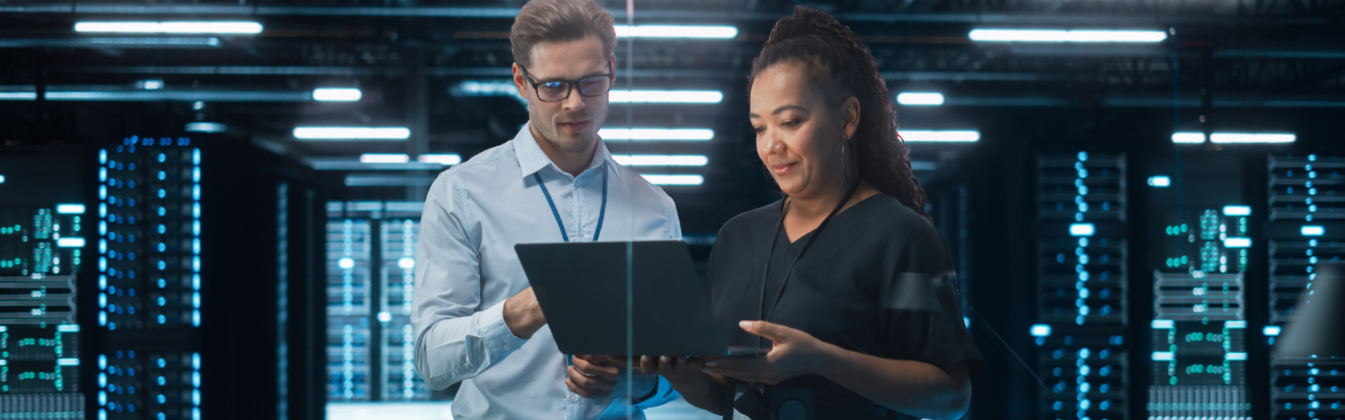 Office workers looking at a laptop