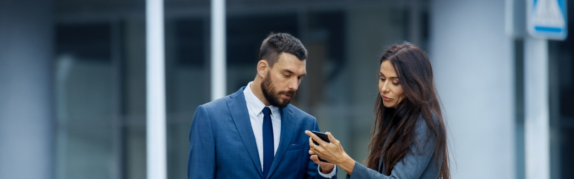 Professional workers looking at phone